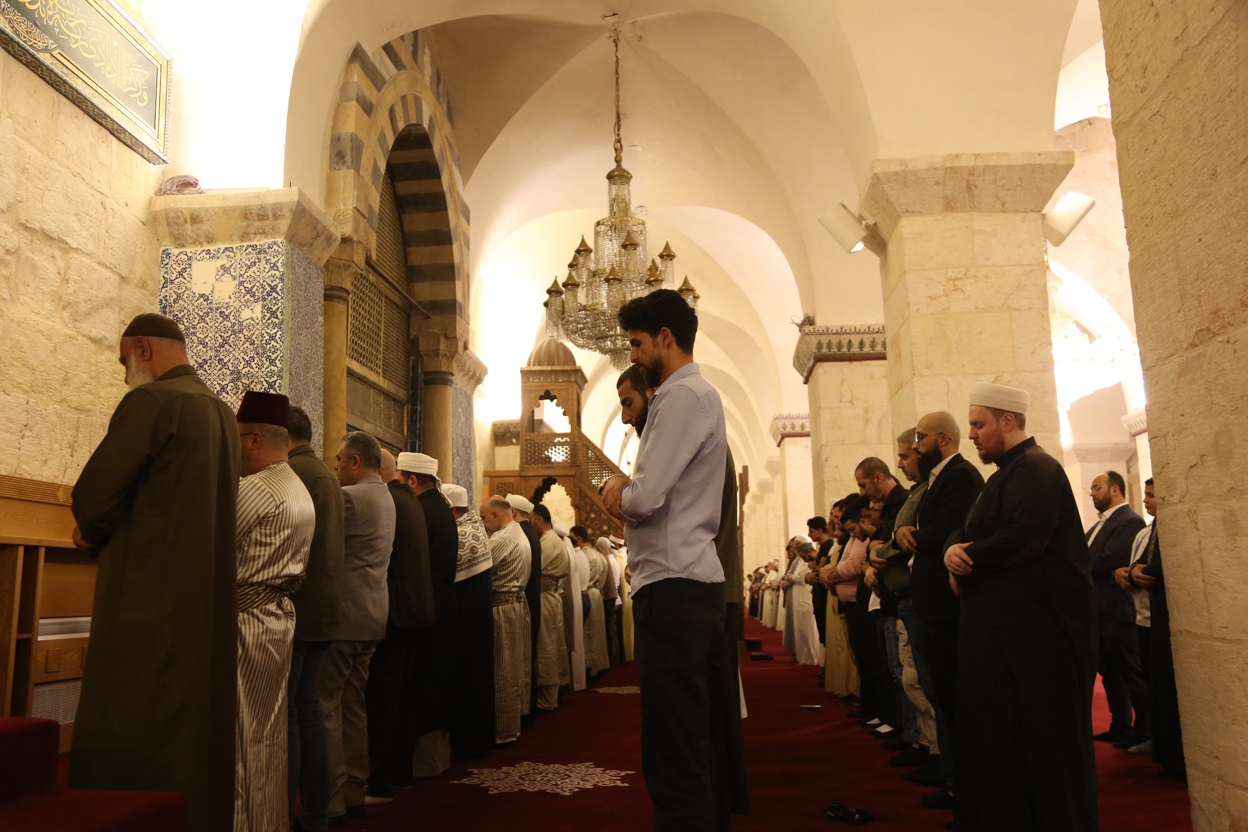 Worshippers pray at the Great Umayyad Mosque of Aleppo after 13 years