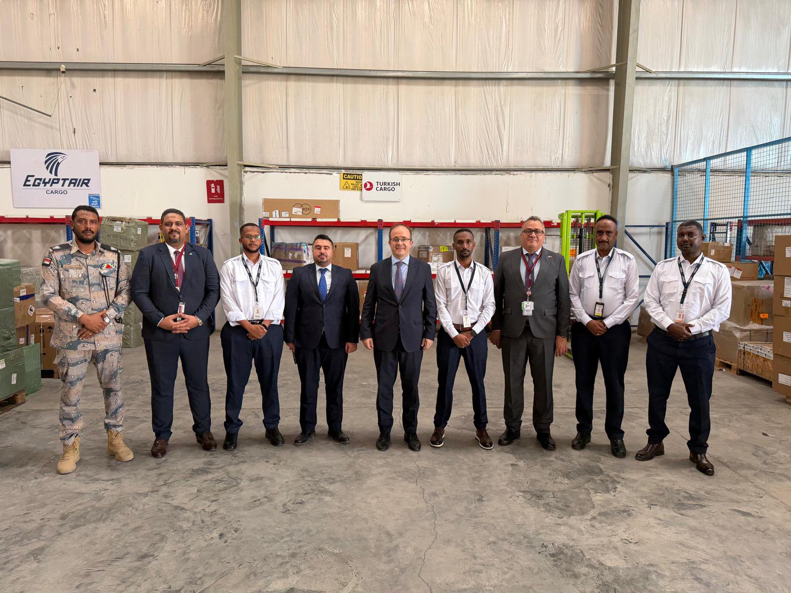 Ambassador Oba in the cargo area of Port Sudan Airport